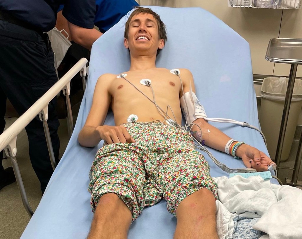 Picture of Eric lying down on a hospital bed right after the collision