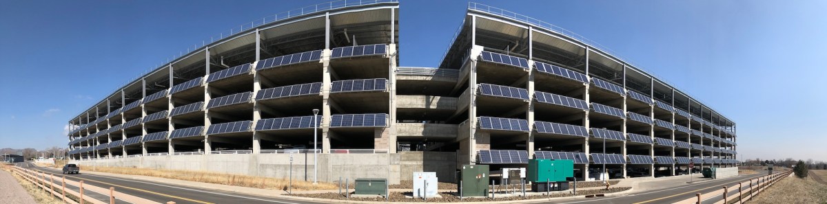 Panoramic view of the NREL garage which is covered in solar panels.